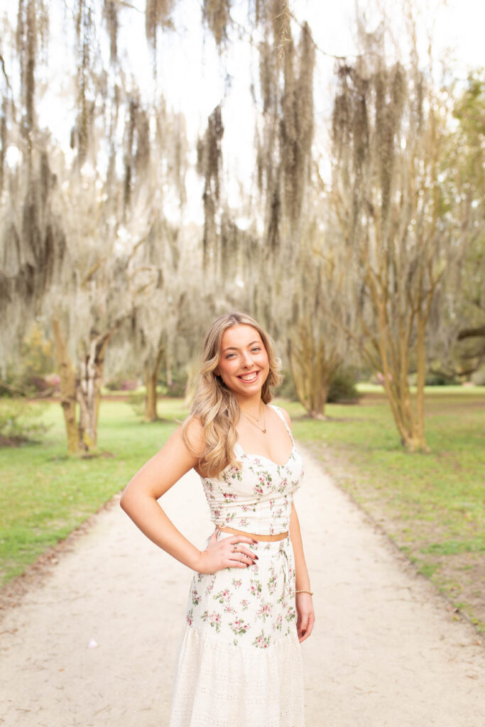 Charleston Senior Photographer capturing high school senior under Spanish Moss at Hampton Park