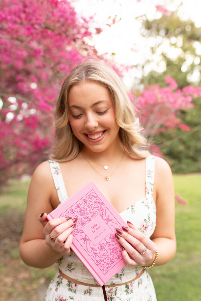Charleston Senior Photographer capturing high school senior under blooming flowers at Hampton Park