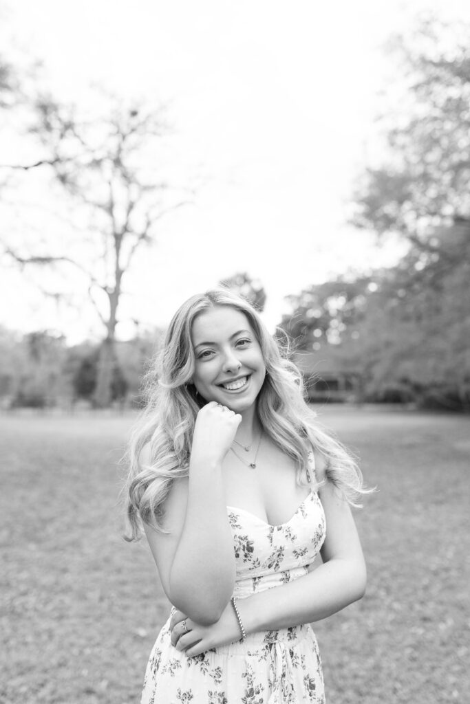 Charleston Senior Photographer capturing high school senior in open field at Hampton Park