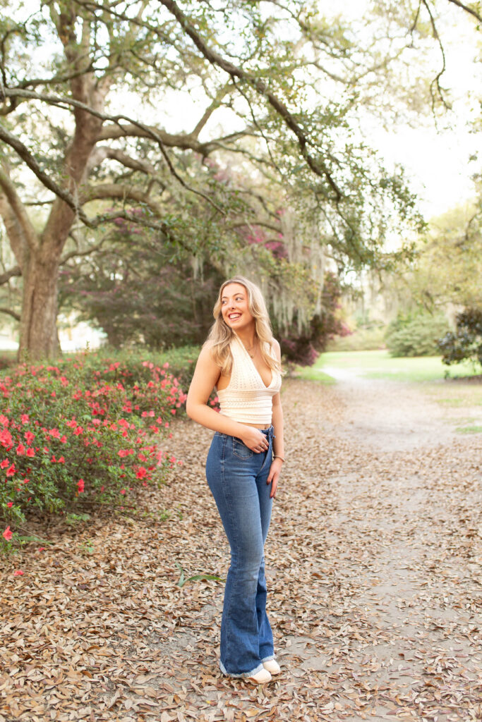 Charleston Senior Photographer capturing high school senior under Spanish Moss at Hampton Park