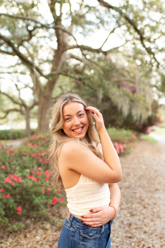 Charleston Senior Photographer capturing high school senior under Spanish Moss at Hampton Park