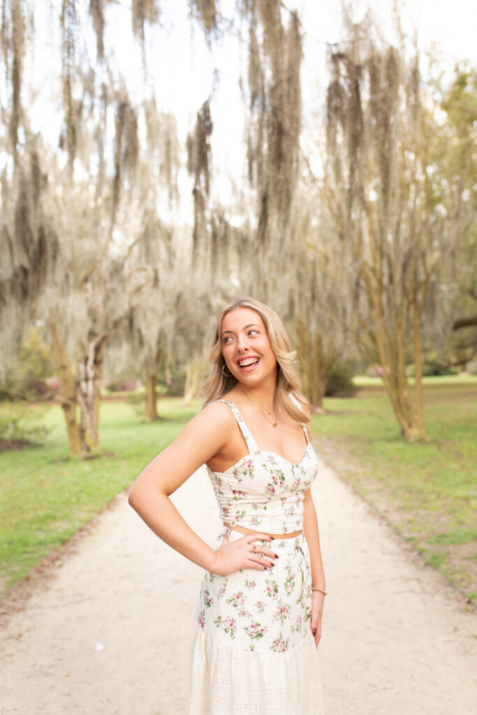 Charleston Senior Photographer capturing high school senior under Spanish Moss at Hampton Park