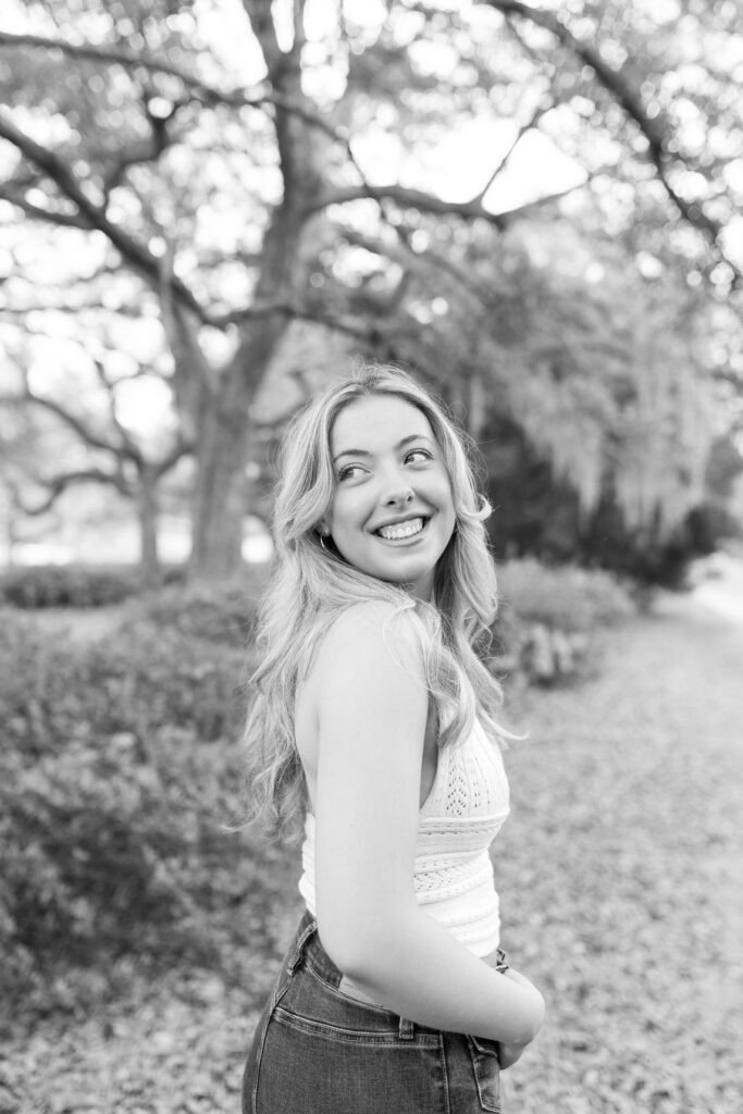 Charleston Senior Photographer capturing high school senior under Spanish Moss at Hampton Park