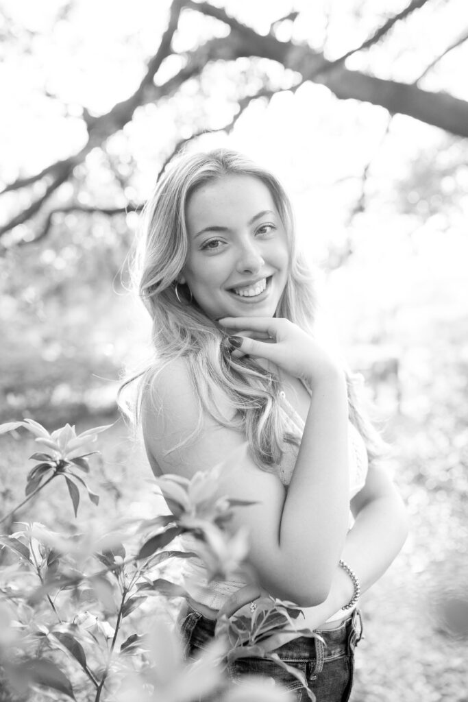 Charleston Senior Photographer capturing high school senior under Spanish Moss at Hampton Park
