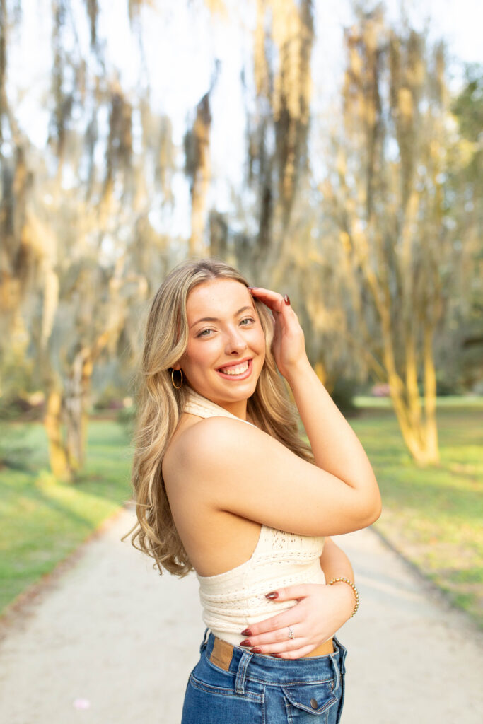 Charleston Senior Photographer capturing high school senior under Spanish Moss at Hampton Park