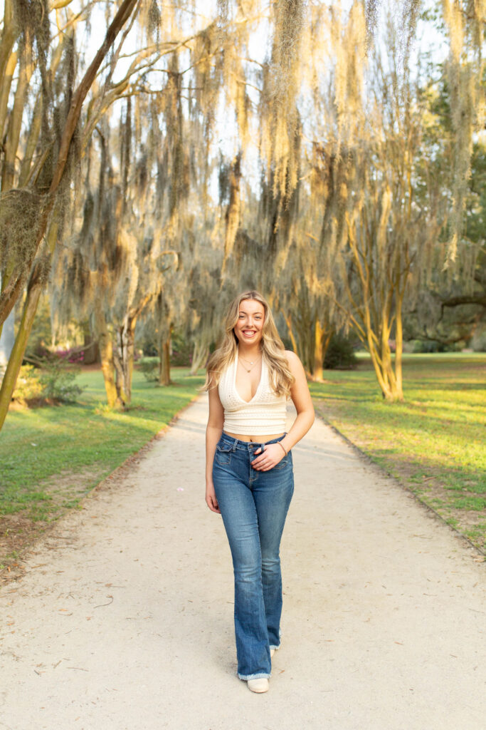 Charleston Senior Photographer capturing high school senior under Spanish Moss at Hampton Park