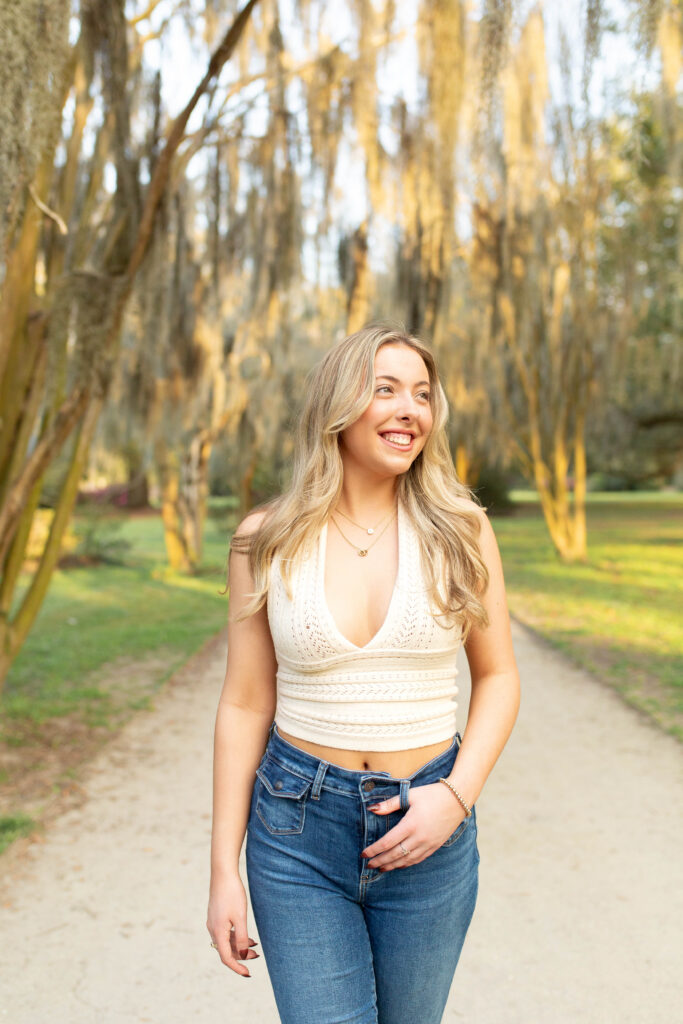 Charleston Senior Photographer capturing high school senior under Spanish Moss at Hampton Park