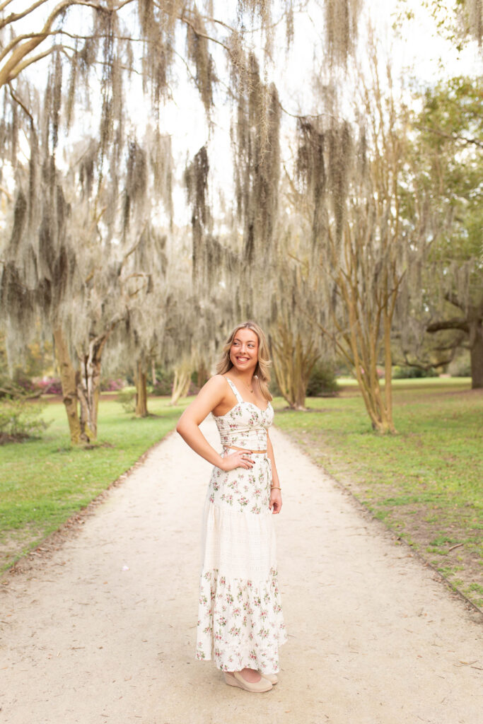 Charleston Senior Photographer capturing high school senior under Spanish Moss at Hampton Park