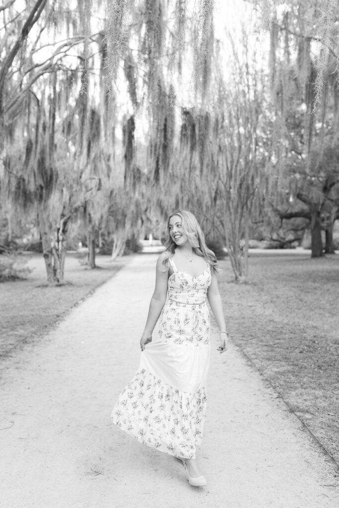 Charleston Senior Photographer capturing high school senior under Spanish Moss at Hampton Park