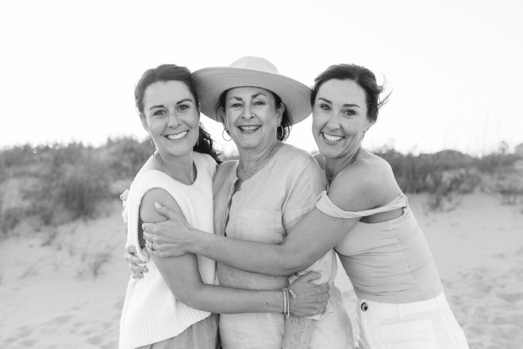 A Mother and her two adult daughters on the beach during an extended family session
