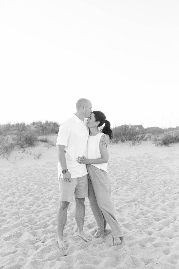 Individual couple's portrait taken on the beach during an extended family photo session